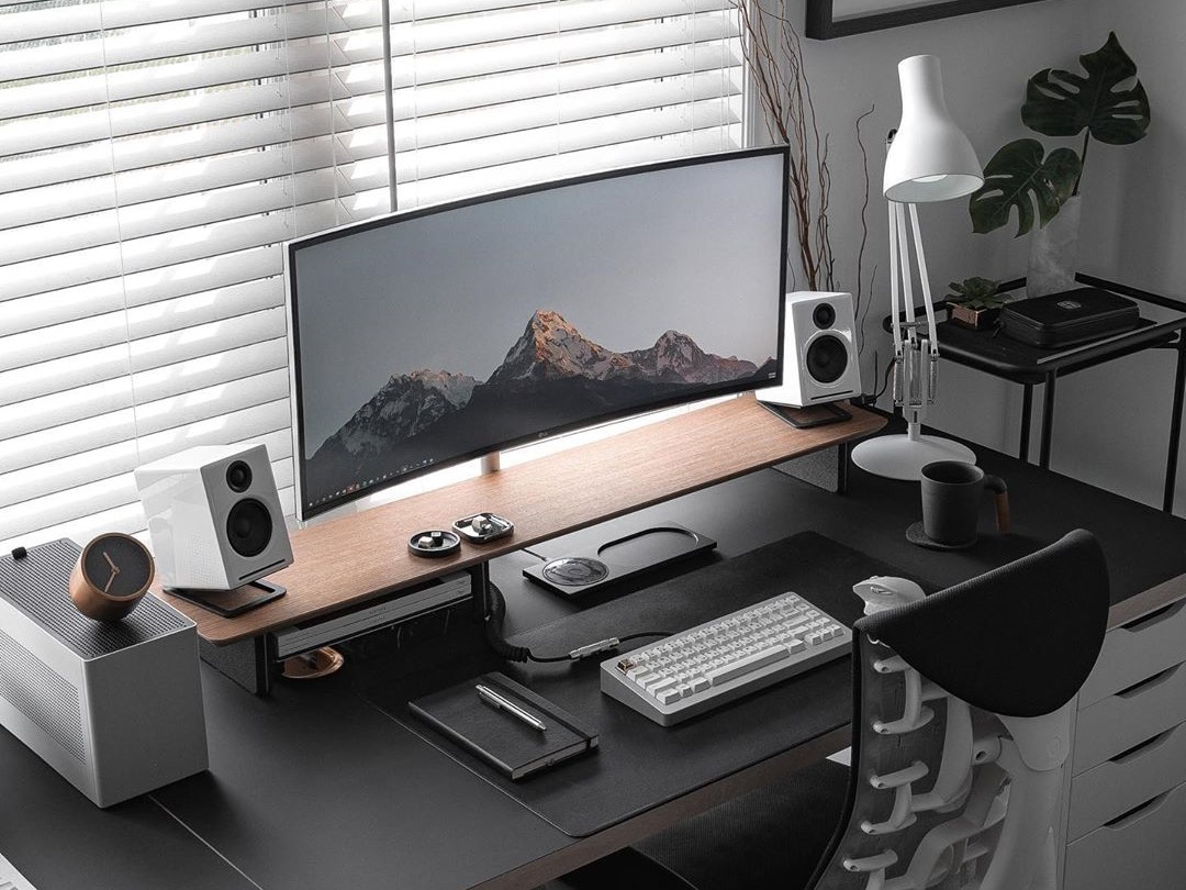 Professional desk setup with multiple monitors and RGB lighting